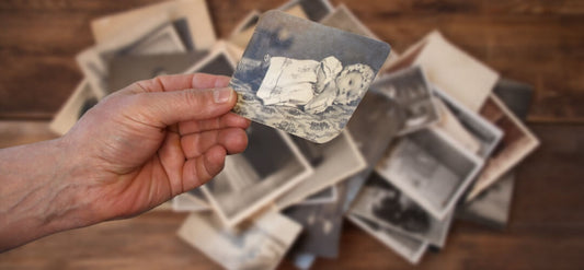 a man holding photos 