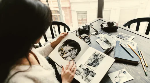 a person looking at a photo album 