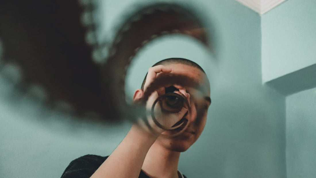 a man holding a negative film wondering what vinegar syndrom is