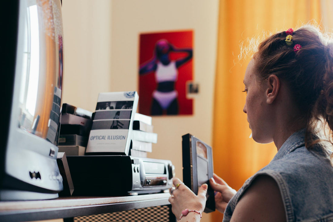 a woman thinking about Best Places to Digitize VHS Tapes in Atlanta