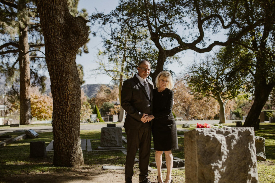 a couple hugging at the cemetery