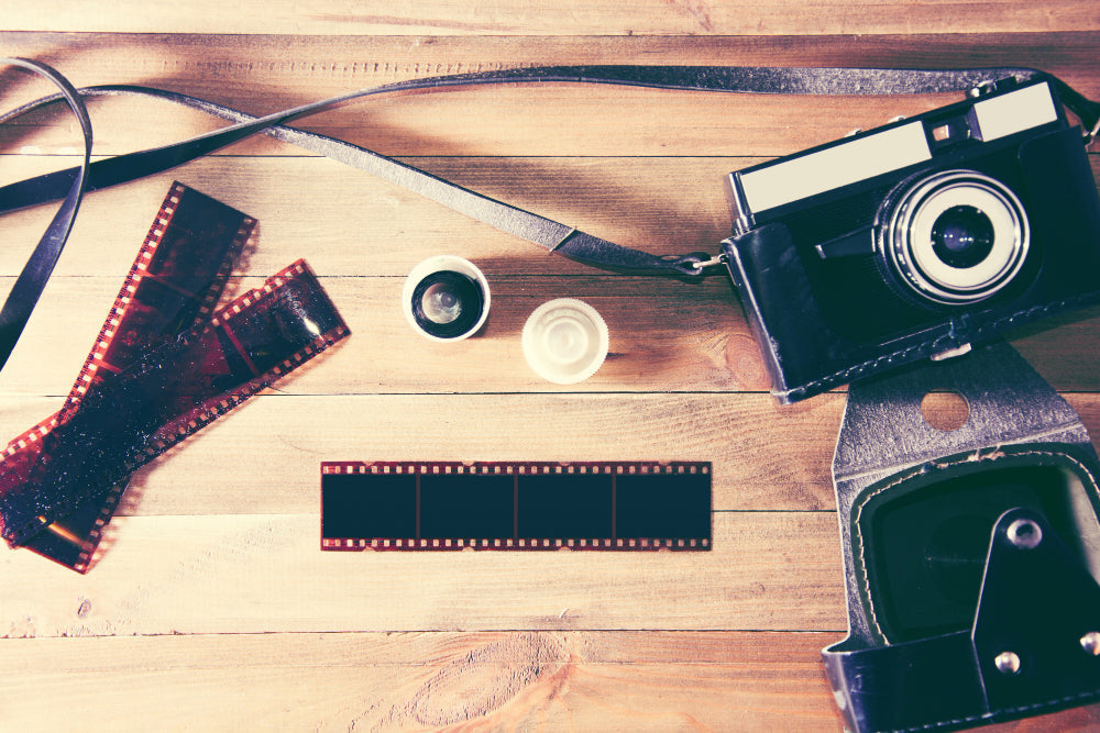 negatives and a camera on the table 